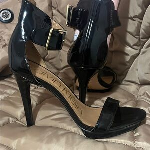 Calvin Klein Glossy Black Heels with Gold Buckle